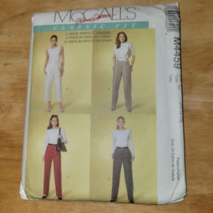 May include: A McCall's Classic Fit sewing pattern envelope for 3 Hour Perfect Trousers, model M4459. The white paper packaging features four illustrations of trousers in different colors and styles, labeled A, B, C, and D, with text in English, French, and Spanish.