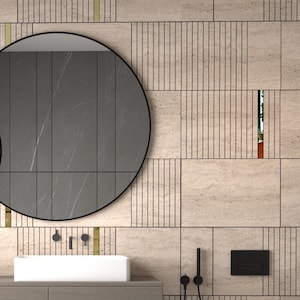 May include: A modern bathroom with a neutral color palette. Two round black mirrors hang above a floating vanity with a white rectangular sink. The walls are tiled with a textured pattern. Two woven baskets sit below the vanity.