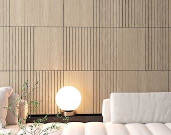 May include: A modern living room featuring a white sectional sofa with a blue accent pillow. A round, white marble coffee table holds a decorative figurine. The background showcases a light wood panel wall with vertical grooves, and a spherical lamp.