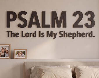 May include: Dark brown wall-mounted lettering displaying the text PSALM 23 The Lord Is My Shepherd. The letters are cut in a bold, sans-serif font and are mounted directly onto a plain, light-colored wall above a bed with neutral bedding.