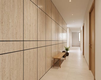 May include: A long hallway featuring a wall covered in light beige travertine panels with dark horizontal and vertical seams. A wooden bench sits against the wall, accompanied by a small potted green plant in a dark round container.