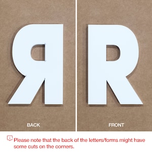 May include: White letter R, front and back views. The back of the letter has cuts on the corners.