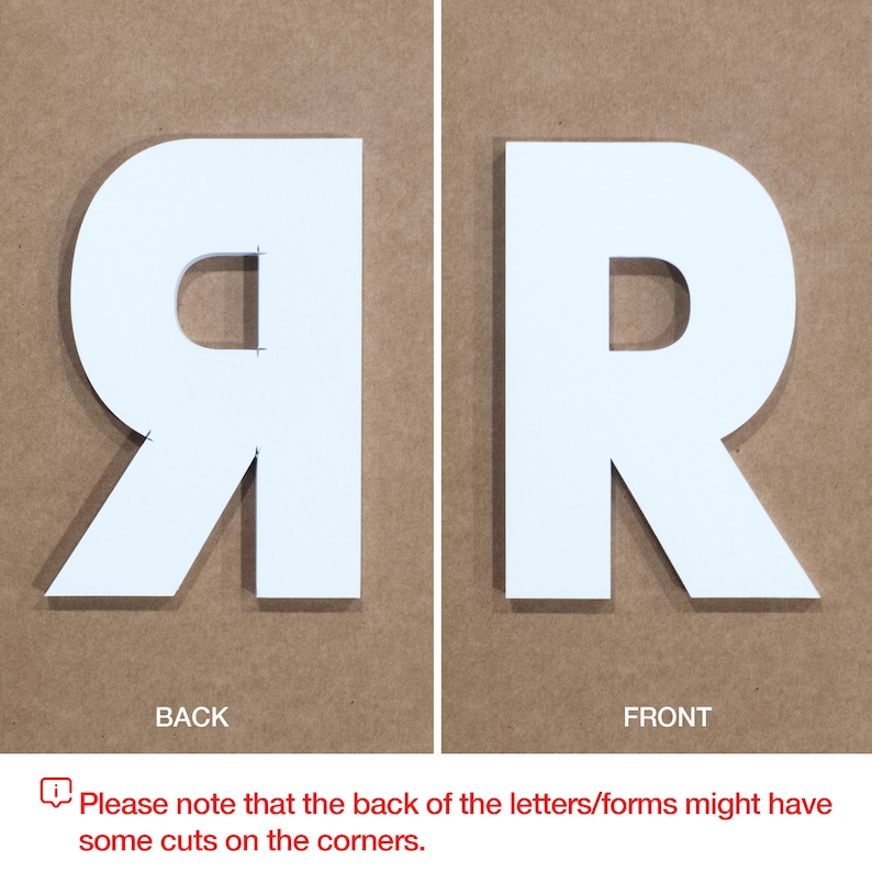 May include: White letter R, front and back views. The back of the letter has cuts on the corners.
