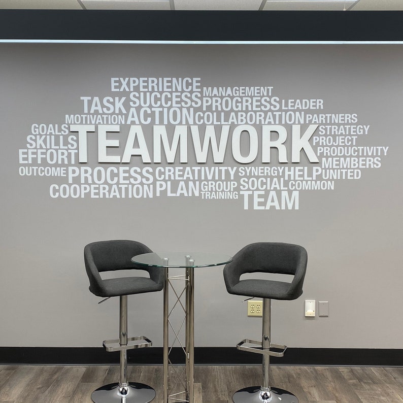 Teamwork in white PVC 10mm with white wall decal letters applied in client office over a grey wall