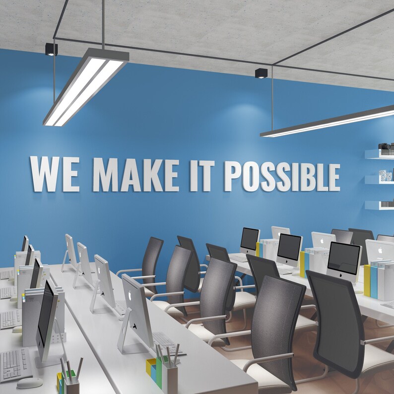 May include: A modern office space with a white desk and black chairs. The wall is painted blue and features the text "WE MAKE IT POSSIBLE".