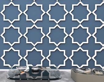 May include: A black glass coffee table with a geometric pattern on the surface. The table is sitting on a grey concrete floor in front of a wall with a white geometric pattern.