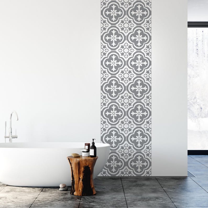 May include: A vertical strip of wall tiles featuring a repeating grey and white quatrefoil pattern. The tiles are arranged in a single column, displaying a symmetrical floral-inspired design with intricate geometric lines and rounded edges.