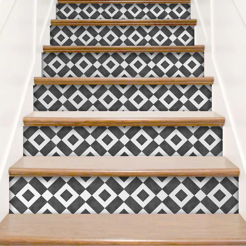May include: A staircase featuring decorative riser decals with a repeating black and white geometric pattern. The design consists of alternating squares and diamonds, applied to the vertical faces of each step between the wooden treads.