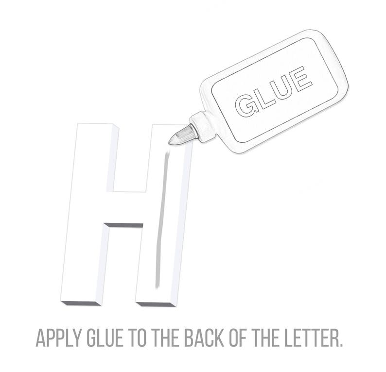 May include: A white letter H with a line of glue being applied to the back of the letter. The glue bottle says "GLUE" on the label. The text "APPLY GLUE TO THE BACK OF THE LETTER." is below the image.