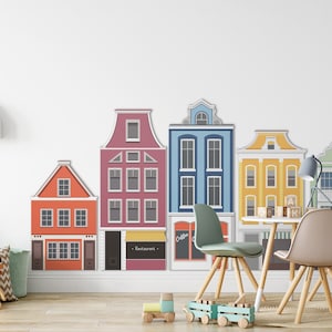 May include: A colorful wall decal featuring a row of five houses with different colored doors and windows. The houses are in a cartoon style and are perfect for a child's room or playroom.