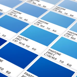 May include: A grid of blue Pantone color swatches, each labeled with its specific Pantone number and CMYK color values. The squares display various shades of blue, ranging from light sky blue to deep royal blue, arranged in a structured pattern.