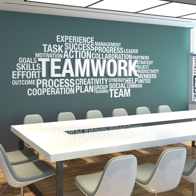 Teamwork in white PVC 10mm with white wall decal letters applied in client office over a green wall