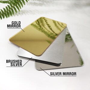 May include: Three different types of mirror finish samples: gold mirror, brushed silver, and silver mirror.