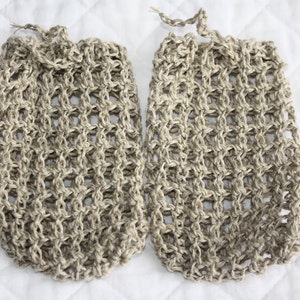 May include: Two beige crocheted mesh bags, possibly for bath or shower use.