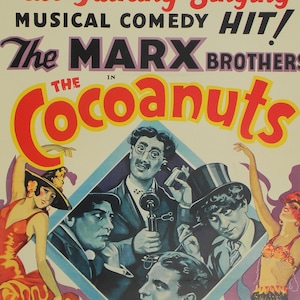May include: A vintage movie poster for the Marx Brothers film "The Cocoanuts". The poster features a colorful design with the title in large, bold letters. The poster also includes images of the Marx Brothers and other actors in the film.