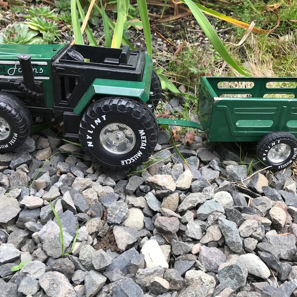 Vintage Nylint Farms Toy Tractor and Matching Trailer.