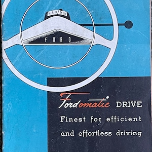 May include: A blue and white brochure with a black and red Fordomatic Drive logo. The text reads "Fordomatic Drive Finest for efficient and effortless driving".