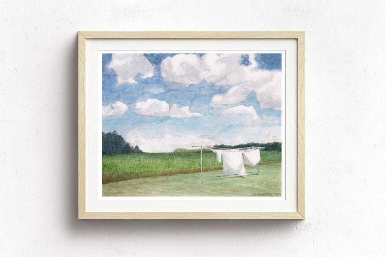 May include: Watercolor painting of a rural landscape with a clothesline in the foreground. White sheets hang on the line against a backdrop of green grass, a line of trees, and a blue sky with fluffy white clouds.