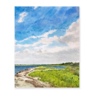 May include: Watercolor painting of a coastal landscape with a blue sky, white clouds, and green grass. The painting depicts a narrow strip of land with a path leading to a body of water.