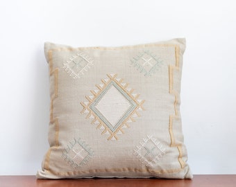 Embroidered geometric pattern pillow - stone-colored