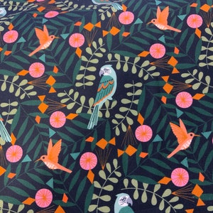 May include: A dark blue fabric with a repeating pattern of green leaves, orange and pink flowers, and green, blue, and orange birds.