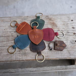 Genuine Leather Guitar shaped Pick Holder Keychain with Belt for guitar picks Keychain Quarter holder key chain, Mandolin, Ukulele or Bass