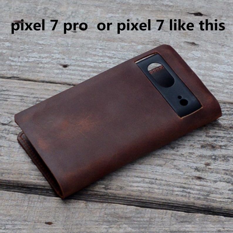 May include: A brown leather phone case with a cutout for the camera lens. The case is designed for a Pixel 7 Pro or Pixel 7 phone.