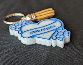 White She/They Keychain