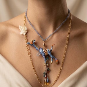 Clotilde · Giraffe statement necklace · Upcycled repainted toy & vintage components · Blue, plum, gold leaf · Made in Italy · One of a kind