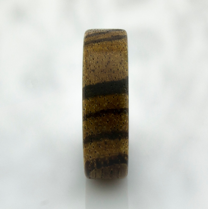 Carbon Fiber ring with Zebra wood.