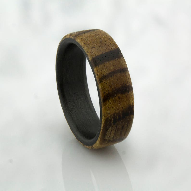 Carbon Fiber ring with Zebra wood.