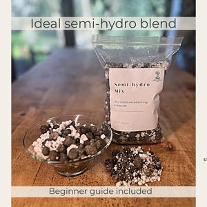 May include: A clear plastic bag filled with a semi-hydro mix substrate, featuring dark brown clay pebbles and white perlite. The label reads Semi-hydro Mix, Airy moisture-balancing substrate. A glass bowl and a small pile contain the same mix.