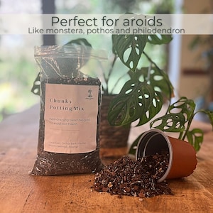 May include: A bag of "Chunky Potting Mix" with a label detailing the blend's composition and purpose. A terracotta-coloured plant pot is tipped over, spilling potting mix onto a wooden surface. The text "Perfect for aroids" is at the top.