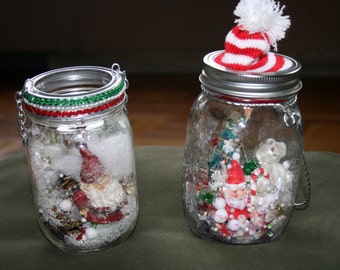 XMAS SNOW waterless globes with winter/holiday scenes -- Santa and toys under tree; Santa in snow; Christmas revelers frolic in the snow