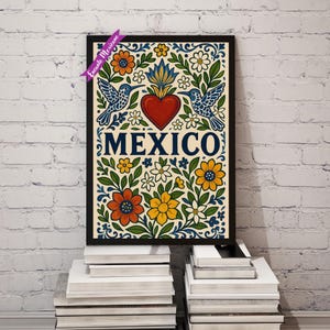 Pode incluir: Uma impress&atilde;o de arte emoldurada com um design vibrante com a palavra "MEXICO". A obra de arte inclui um cora&ccedil;&atilde;o vermelho, beija-flores e flores coloridas em laranja, amarelo e branco, em um fundo creme. A moldura &eacute; preta.