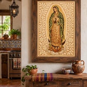 May include: A framed religious artwork depicting a figure with a halo, wearing a green and gold robe, and surrounded by a floral design. The artwork is displayed above a wooden table with decorative pottery and a small potted plant.