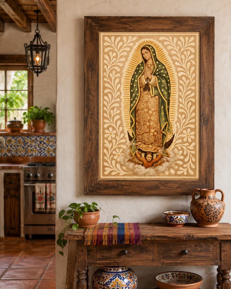 May include: A framed religious artwork depicting a figure with a halo, wearing a green and gold robe, and surrounded by a floral design. The artwork is displayed above a wooden table with decorative pottery and a small potted plant.