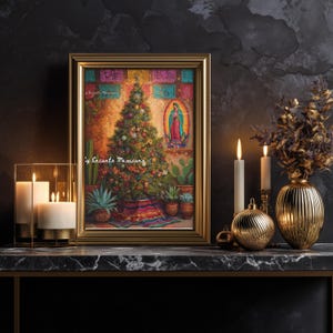 May include: A framed painting with a gold frame depicts a Christmas tree with colorful ornaments and a Virgin Mary image. The painting is set on a marble surface with lit candles and gold decorative elements. The text "y Encanto Mexicano" is visible.
