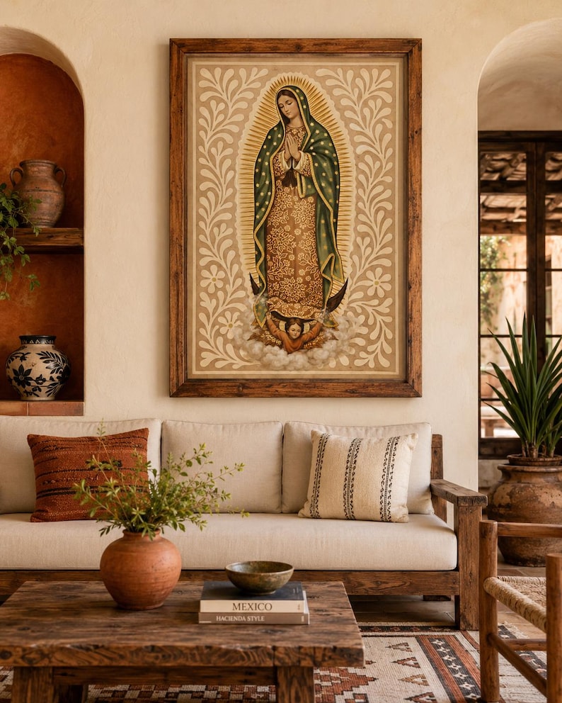 May include: A framed religious artwork depicting a figure in a green and gold robe, hands clasped in prayer. The artwork is set against a beige background with floral patterns. The image is displayed above a wooden sofa with decorative pillows.