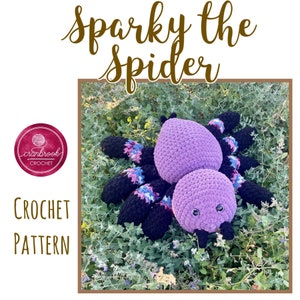 May include: A crochet pattern for Sparky the Spider, a purple and black crocheted spider with large eyes. The pattern is available for purchase on Etsy.