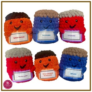 May include: Six crocheted plush jars with smiling faces and different colored yarn. Each jar is holding a sign with a different message: "Spread the love", "This is my jam", "Just Jammin', "You're my jam", "We're marmalade for each other", and "Let's jam".