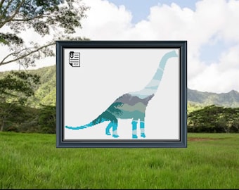 May include: A cross-stitch pattern of a blue and green dinosaur silhouette with a mountain landscape inside. The pattern is in a black frame and is ready to be downloaded as a PDF.