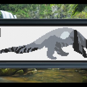 May include: A black and white cross-stitch pattern of a stylized animal with a long tail and a large head. The animal is in a walking pose. The pattern is framed in a black frame.