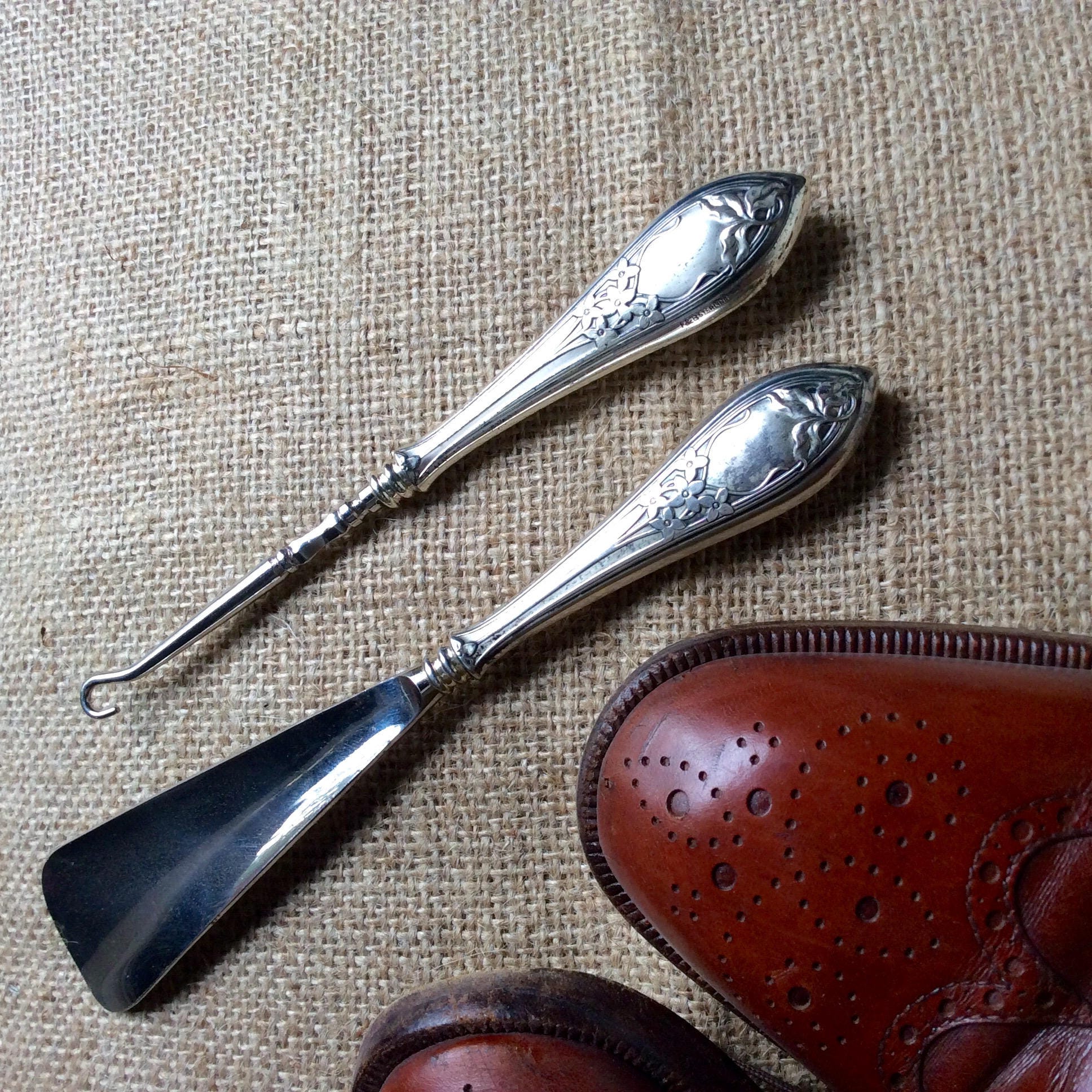 Antique buttonhooks and shoehorns. A buttonhook is a tool used to  facilitate the closing of shoes, gl…