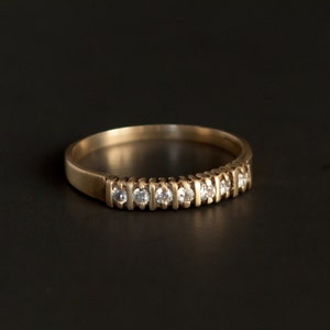 10K yellow gold band with 7 small round CZs Size 7