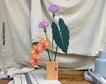 Bouquet di Orchidea, Garofani e foglia di alocasia.