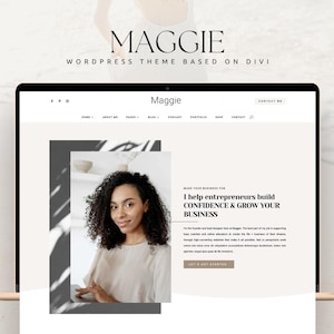 以下が含まれることがあります： DiviベースのWordPressテーマ「Maggie」を表示したノートパソコンの画面。ウェブサイトにはナビゲーションメニュー、巻き毛の人物の写真、そして「I help entrepreneurs build confidence & grow your business.」というテキストが含まれています。