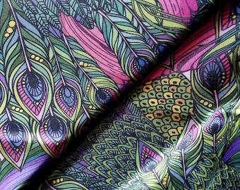 May include: A colorful fabric with a peacock feather pattern. The fabric features a repeating design of green, blue, and pink feathers with intricate details.