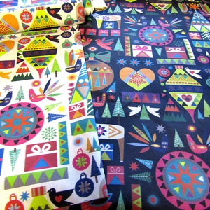 May include: Two fabric swatches featuring a repeating pattern of colourful geometric shapes, including stars, trees, birds, and presents. The fabric on the left is white with a red, blue, and green pattern. The fabric on the right is dark blue with a red, yellow, and green pattern.