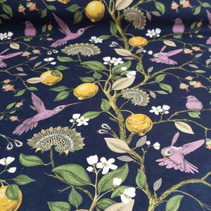 May include: A dark blue fabric with a repeating pattern of hummingbirds, lemons, and flowers. The hummingbirds are pink and have long beaks. The lemons are yellow and have green leaves. The flowers are white and have green stems.